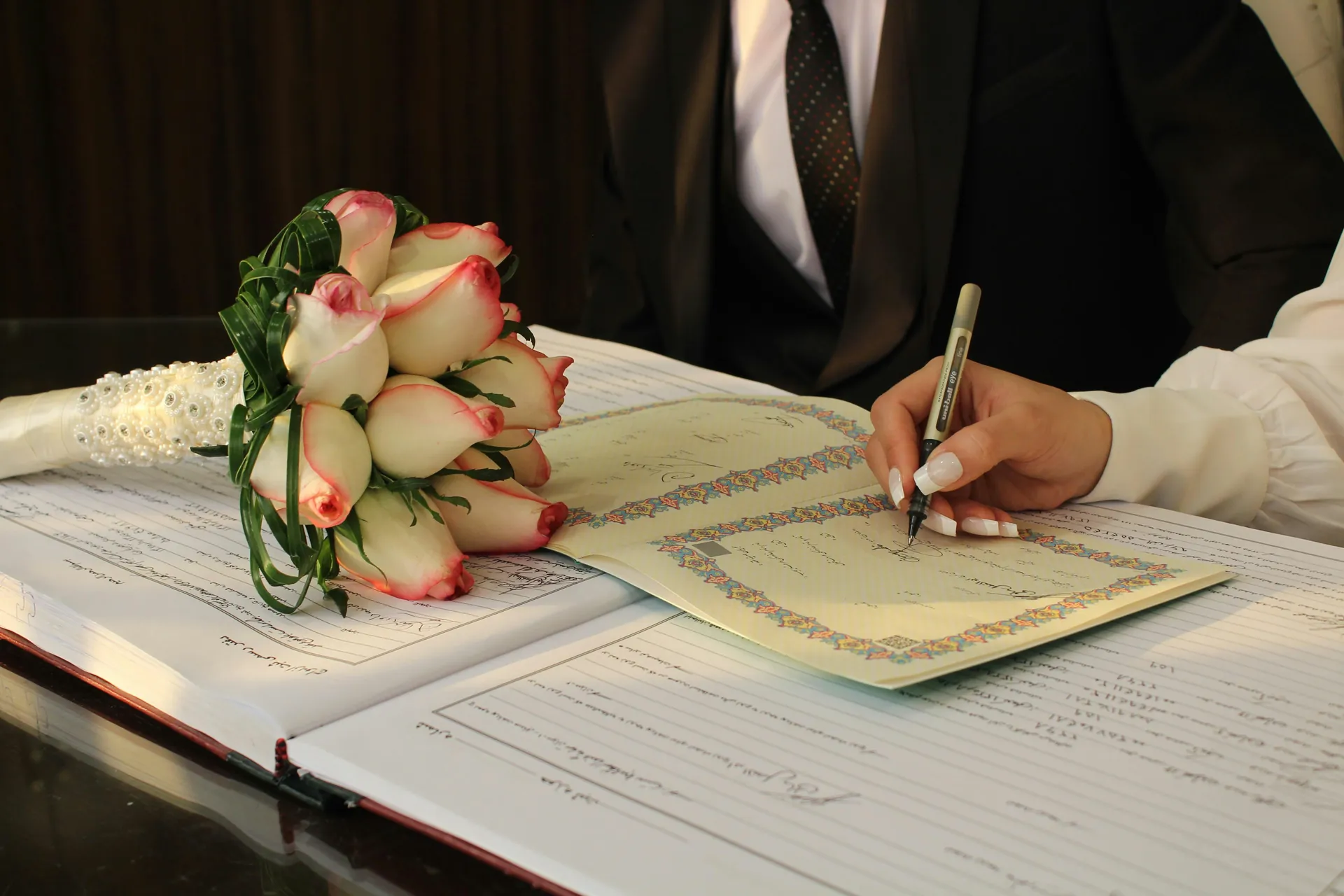 Signature mariage et bouquet de fleurs